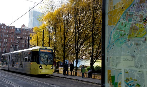 Tram running through centre of Manchester