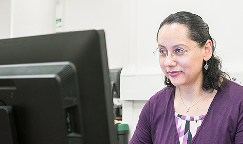 CPI researcher at her computer