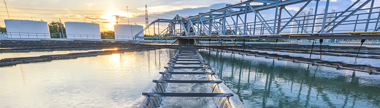 A water system with a sunset behind it