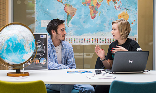 Student and advisor discussing study abroad programme in careers centre